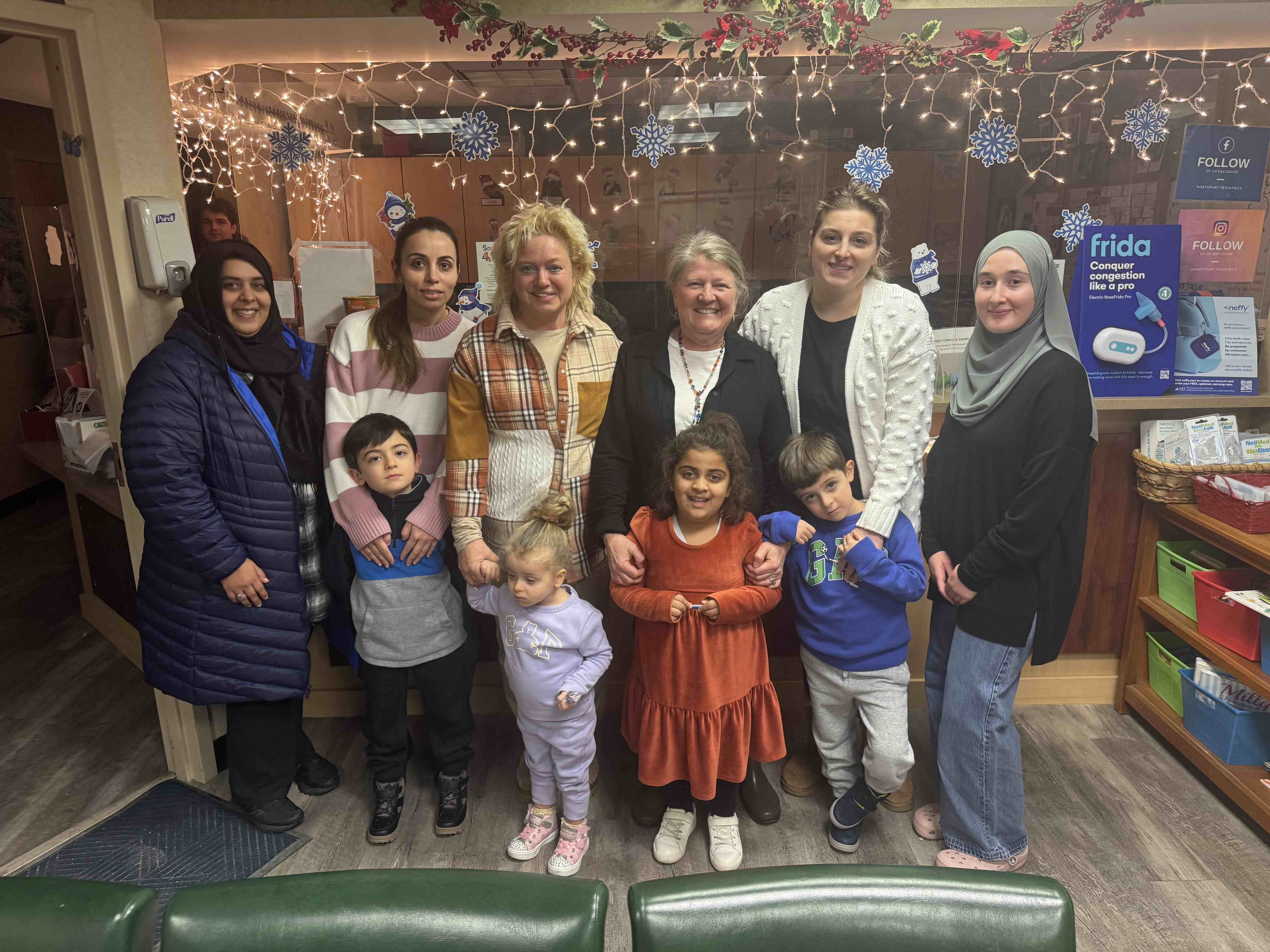 Northport Pediatrics staff and families celebrating the holidays at the office